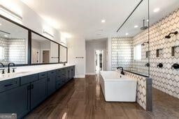 320 Dodd Ln, Alpharetta, GA 30005 - full bathroom featuring walk in shower, a freestanding bath, double vanity, and wood finished floors