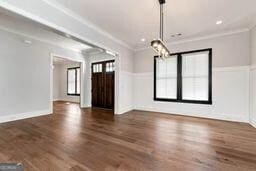 320 Dodd Ln, Alpharetta, GA 30005 - unfurnished living room with ornamental molding and wood finished floors