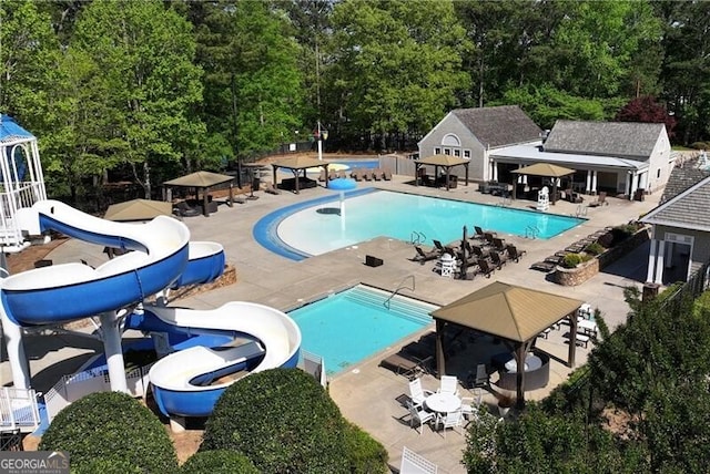320 Dodd Ln, Alpharetta, GA 30005 - community pool featuring a gazebo, an outbuilding, a patio, and a storage structure