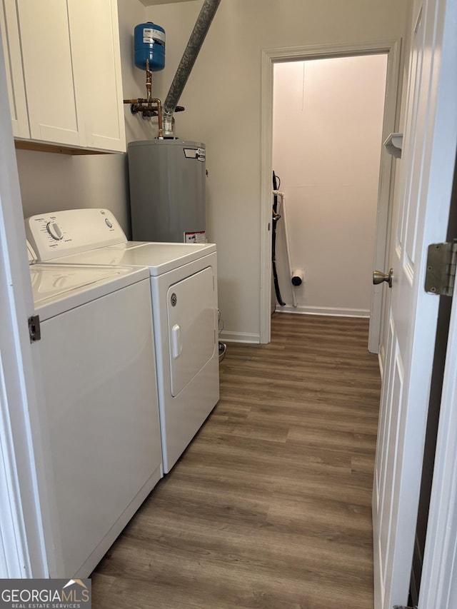 135 Courtyard Ln, Fayetteville, GA 30215 - laundry area featuring washing machine and dryer, water heater, cabinet space, wood finished floors, and baseboards