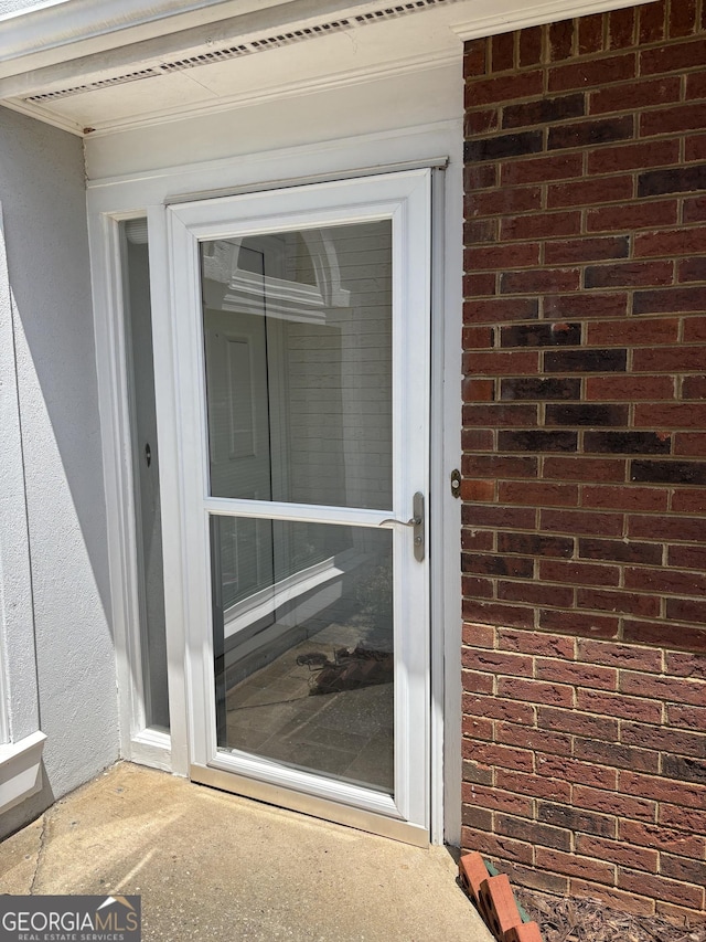 135 Courtyard Ln, Fayetteville, GA 30215 - doorway to property featuring brick siding