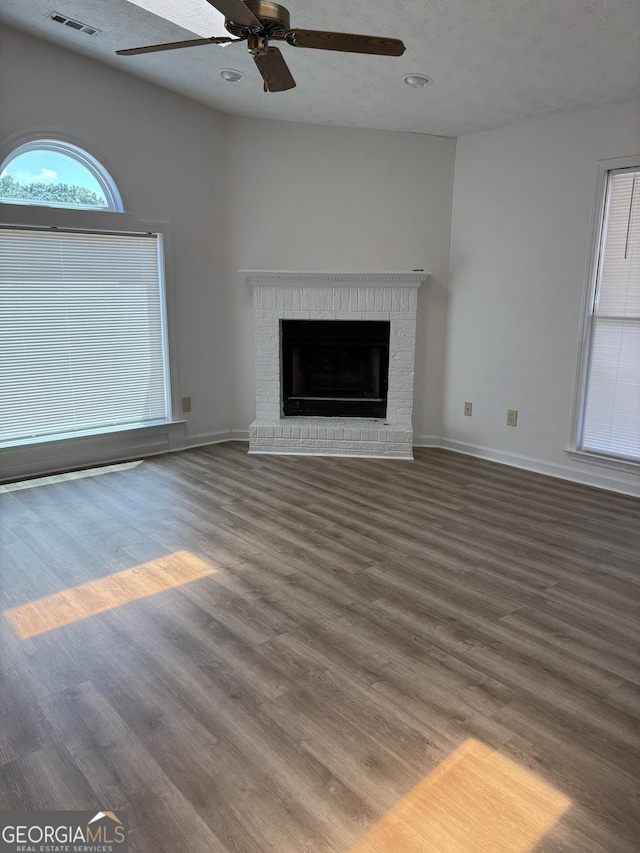 135 Courtyard Ln, Fayetteville, GA 30215 - unfurnished living room featuring wood finished floors, ceiling fan, baseboards, a brick fireplace, and recessed lighting