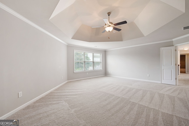 6585 Canyon Cv, Cumming, GA 30028 - unfurnished room with a raised ceiling, light colored carpet, ceiling fan, and crown molding