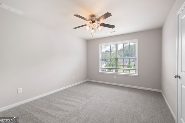 6585 Canyon Cv, Cumming, GA 30028 - unfurnished room featuring light colored carpet and ceiling fan