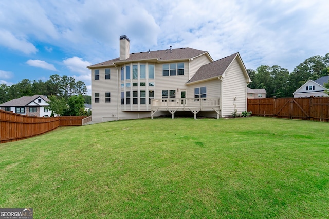 6585 Canyon Cv, Cumming, GA 30028 - back of property with a fenced backyard and a chimney