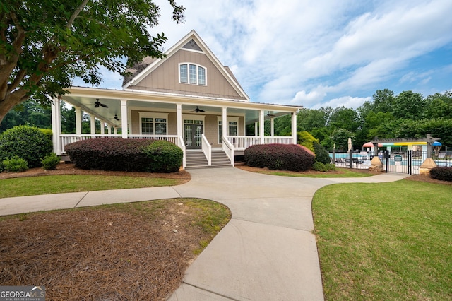 6585 Canyon Cv, Cumming, GA 30028 - country-style home featuring ceiling fan, a porch, and board and batten siding