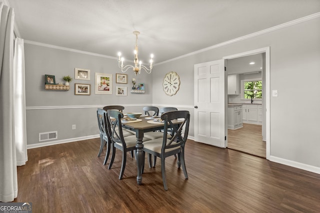 2121 Elysian Cir, Gainesville, GA 30501 - dining space with a chandelier, dark wood-style flooring, and ornamental molding