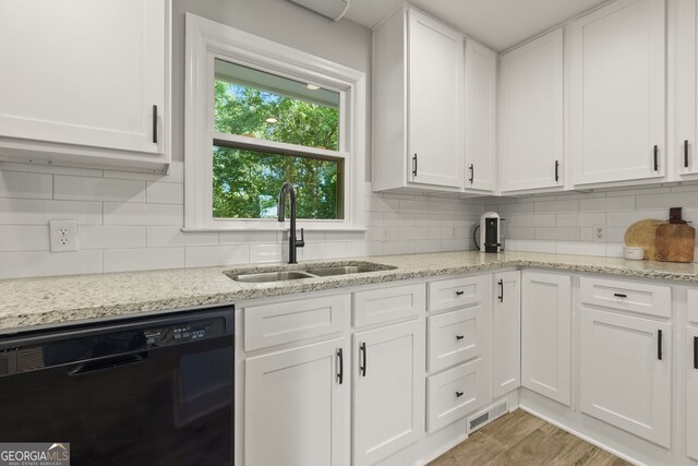 2121 Elysian Cir, Gainesville, GA 30501 - kitchen with black dishwasher, a sink, white cabinetry, and decorative backsplash