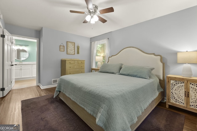 2121 Elysian Cir, Gainesville, GA 30501 - bedroom featuring wood finished floors, ensuite bathroom, and ceiling fan
