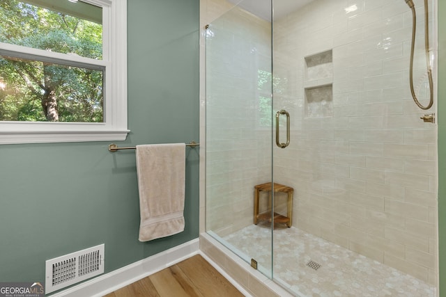 2121 Elysian Cir, Gainesville, GA 30501 - full bath featuring a shower stall and wood finished floors