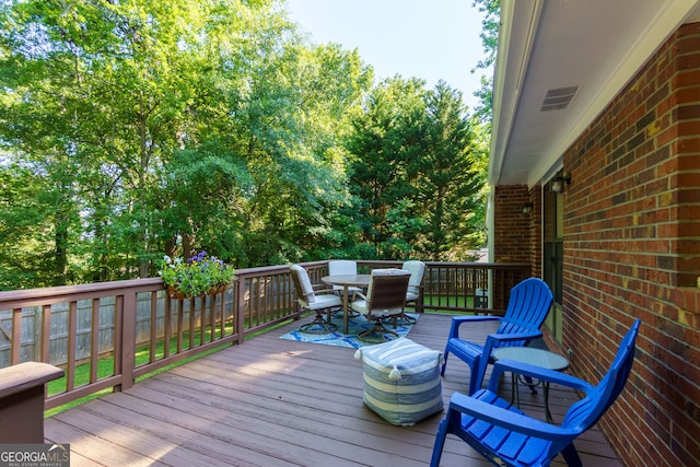 2121 Elysian Cir, Gainesville, GA 30501 - deck with outdoor dining area and a fenced backyard