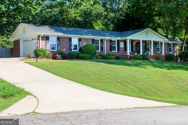 2121 Elysian Cir, Gainesville, GA 30501 - view of front facade featuring brick siding, driveway, an attached garage, and a porch