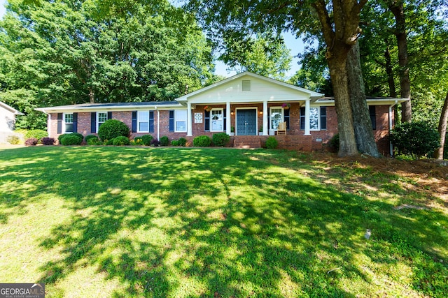 2121 Elysian Cir, Gainesville, GA 30501 - view of front facade with brick siding, a front yard, and a porch