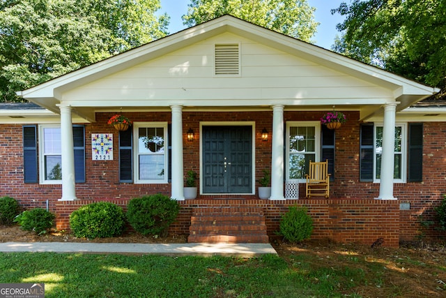 2121 Elysian Cir, Gainesville, GA 30501 - view of front facade with a porch and brick siding