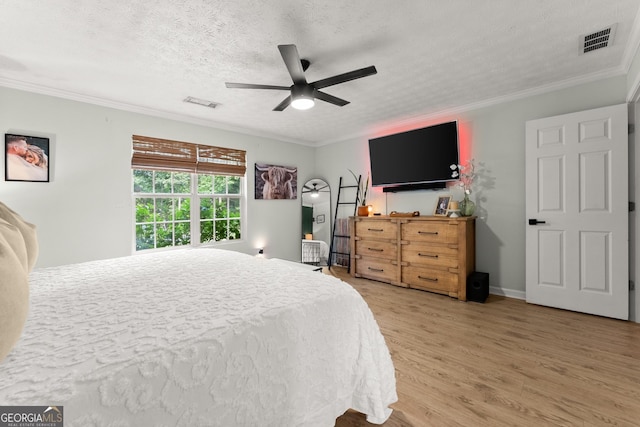 7277 Plum Creek Dr, Gainesville, GA 30507 - bedroom featuring wood finished floors, crown molding, a textured ceiling, and ceiling fan