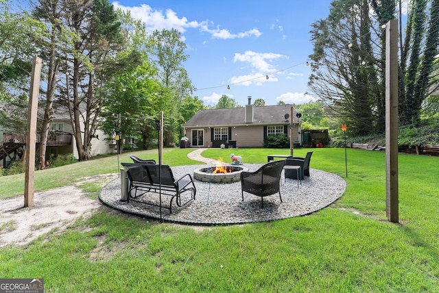 7277 Plum Creek Dr, Gainesville, GA 30507 - view of grassy yard featuring an outdoor fire pit and a patio area