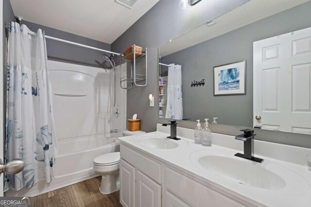 3420 Griffin Way, Cumming, GA 30040 - full bath with shower / tub combo, toilet, double vanity, and wood finished floors