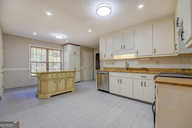 2436 Green Hollow Ct, Conyers, GA 30012 - kitchen featuring stainless steel dishwasher, a sink, light countertops, decorative backsplash, and recessed lighting