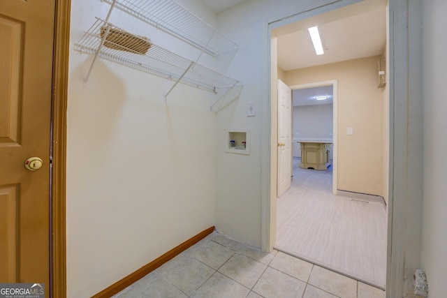 2436 Green Hollow Ct, Conyers, GA 30012 - laundry area with washer hookup, light tile patterned floors, and baseboards