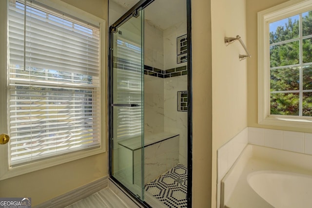 2436 Green Hollow Ct, Conyers, GA 30012 - full bath with a bath, a marble finish shower, and healthy amount of natural light