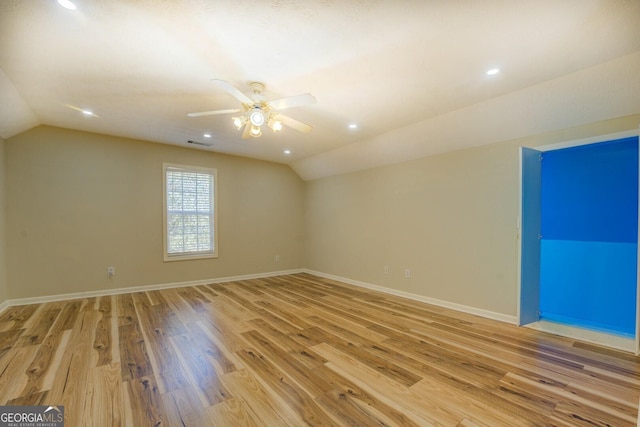 2436 Green Hollow Ct, Conyers, GA 30012 - empty room with vaulted ceiling, ceiling fan, light wood-type flooring, baseboards, and recessed lighting