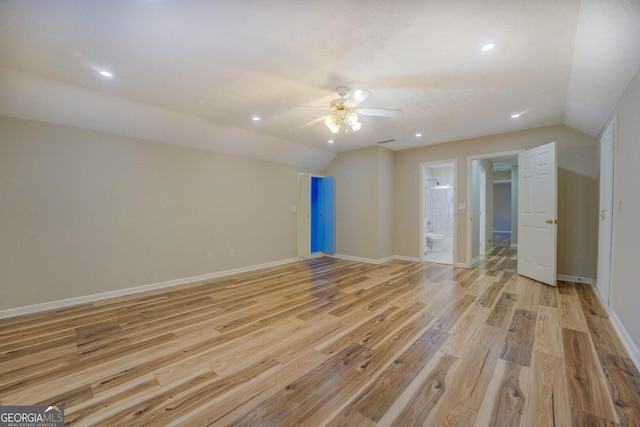 2436 Green Hollow Ct, Conyers, GA 30012 - spare room with vaulted ceiling, light wood-style floors, ceiling fan, baseboards, and recessed lighting