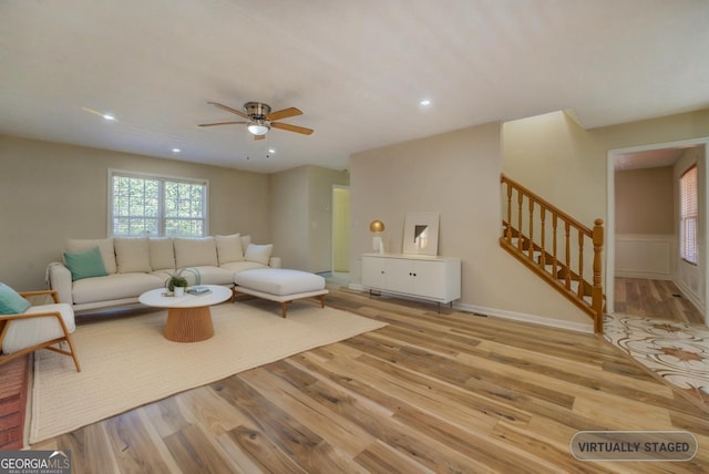 2436 Green Hollow Ct, Conyers, GA 30012 - living room with wood finished floors, a ceiling fan, stairway, and recessed lighting
