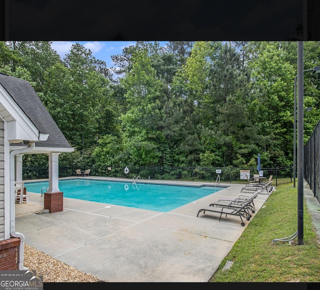 2436 Green Hollow Ct, Conyers, GA 30012 - community pool featuring a patio