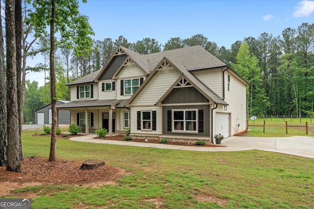 337 Paynes Lake Rd, Carrollton, GA 30116 - craftsman inspired home featuring board and batten siding, driveway, a front lawn, covered porch, and an attached garage