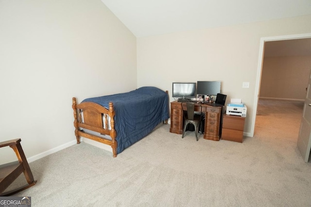 337 Paynes Lake Rd, Carrollton, GA 30116 - bedroom with light carpet, lofted ceiling, baseboards, and a desk