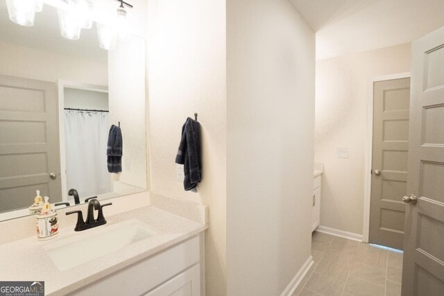 337 Paynes Lake Rd, Carrollton, GA 30116 - bathroom featuring vanity and baseboards