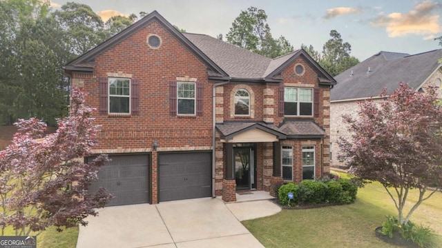 8744 Hamil Ct, Douglasville, GA 30135 - view of front facade with concrete driveway, brick siding, a front lawn, a garage, and roof with shingles
