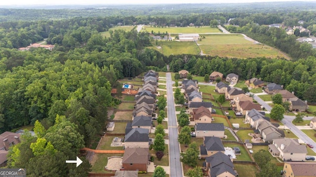 8744 Hamil Ct, Douglasville, GA 30135 - aerial overview of property's location with nearby suburban area and a heavily wooded area
