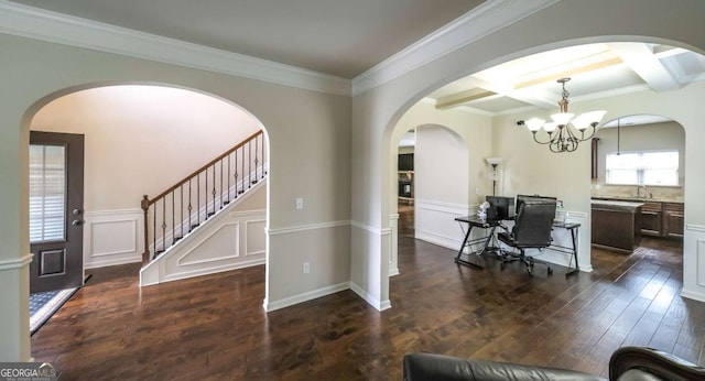 8744 Hamil Ct, Douglasville, GA 30135 - home office with dark wood finished floors, beamed ceiling, coffered ceiling, a chandelier, and a decorative wall