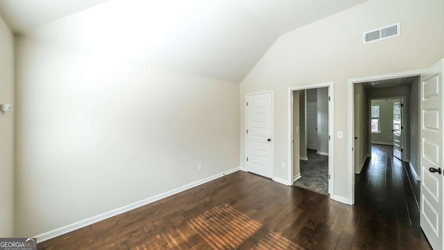 8744 Hamil Ct, Douglasville, GA 30135 - bonus room with dark wood-type flooring, lofted ceiling, and baseboards