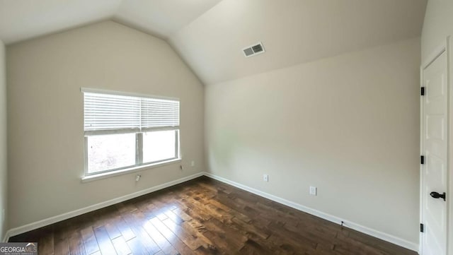8744 Hamil Ct, Douglasville, GA 30135 - spare room featuring lofted ceiling, dark wood finished floors, and baseboards