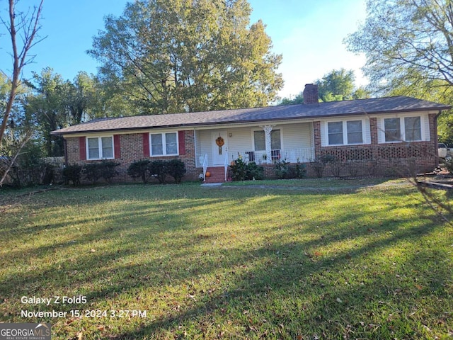 30 Glen View Dr NE, Rome, GA 30165 - ranch-style house with brick siding, a chimney, a front yard, and covered porch