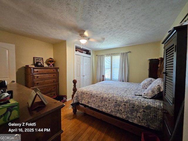 30 Glen View Dr NE, Rome, GA 30165 - bedroom with wood finished floors, a textured ceiling, a closet, and ceiling fan