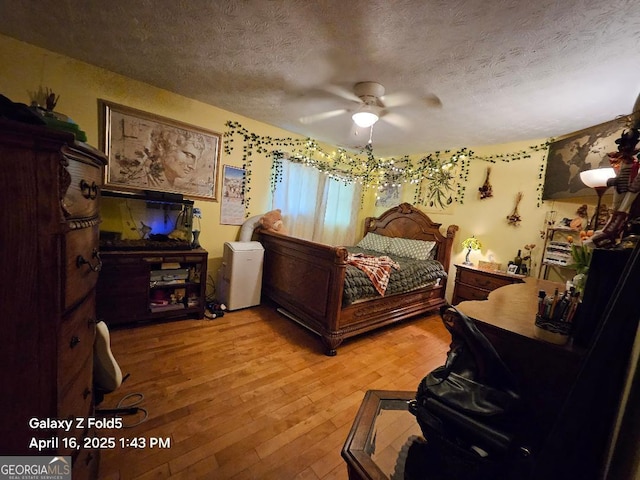 30 Glen View Dr NE, Rome, GA 30165 - bedroom with a textured ceiling, light wood-style flooring, and a ceiling fan