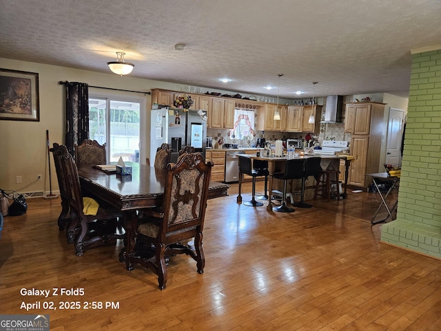 30 Glen View Dr NE, Rome, GA 30165 - dining space featuring a textured ceiling, dark wood-style floors, and plenty of natural light