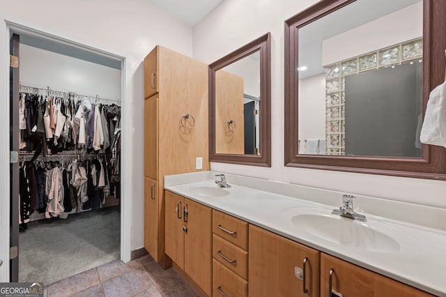 1308 NE Fernwood Cir NE, Atlanta, GA 30319 - bathroom with double vanity, tile patterned flooring, and a walk in closet