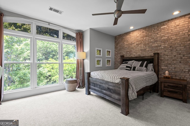 1308 NE Fernwood Cir NE, Atlanta, GA 30319 - carpeted bedroom with multiple windows, brick wall, ceiling fan, and recessed lighting
