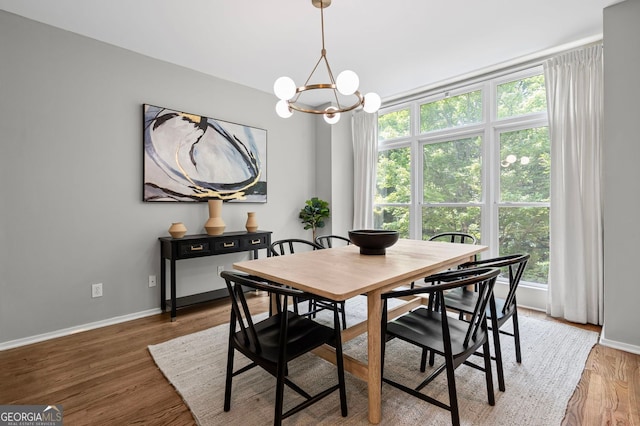 1308 NE Fernwood Cir NE, Atlanta, GA 30319 - dining area with plenty of natural light, a chandelier, baseboards, and light wood finished floors