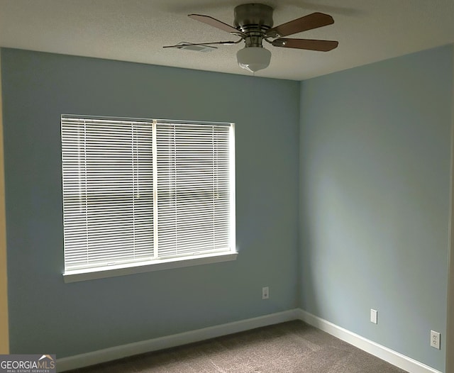 165 Woodgate Cir, Fayetteville, GA 30214 - carpeted empty room featuring a ceiling fan and baseboards
