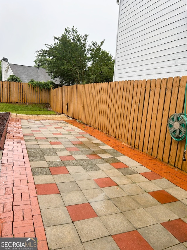 165 Woodgate Cir, Fayetteville, GA 30214 - fenced backyard with a patio area