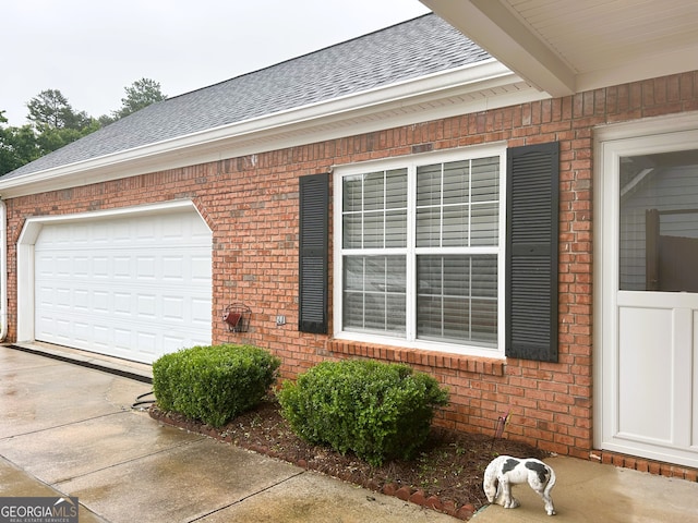 165 Woodgate Cir, Fayetteville, GA 30214 - view of property exterior with brick siding, roof with shingles, driveway, and a garage
