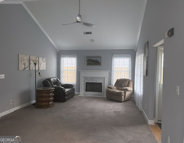 165 Woodgate Cir, Fayetteville, GA 30214 - living room featuring ornamental molding, a ceiling fan, baseboards, a fireplace, and light carpet
