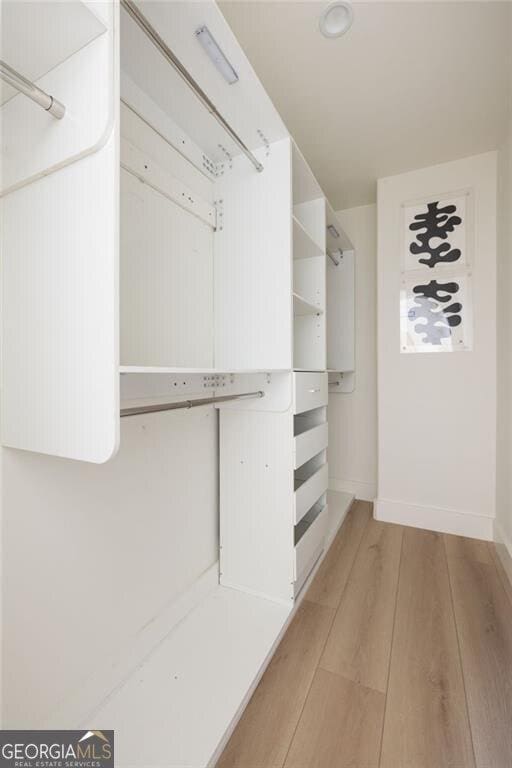 1130 Mclinden Ave SE, Smyrna, GA 30080 - spacious closet with light wood finished floors