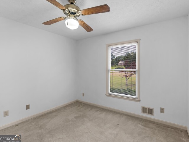 114 Overlook Dr, Mcdonough, GA 30252 - empty room with light colored carpet, baseboards, and a ceiling fan