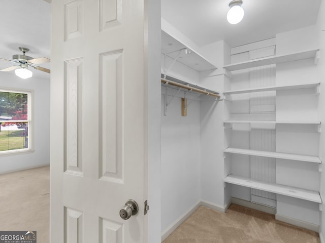 114 Overlook Dr, Mcdonough, GA 30252 - spacious closet with carpet and a ceiling fan
